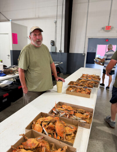 Robert Colon helped serve crabs at the crab feast